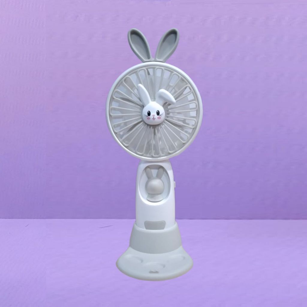 Kipas Angin Genggam Tangan Karakter Bunny Dengan LED + Holder Penyangga HP / Handy Mini Fan Portable Rechargeable Elektrik Motif Kelinci Lucu Travel Size Travelling Outdoor Konser Piknik Pantai Jogging CFD Luar Ruangan Make Up Skincare Multifungsi