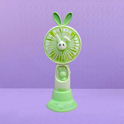 Kipas Angin Genggam Tangan Karakter Bunny Dengan LED + Holder Penyangga HP / Handy Mini Fan Portable Rechargeable Elektrik Motif Kelinci Lucu Travel Size Travelling Outdoor Konser Piknik Pantai Jogging CFD Luar Ruangan Make Up Skincare Multifungsi