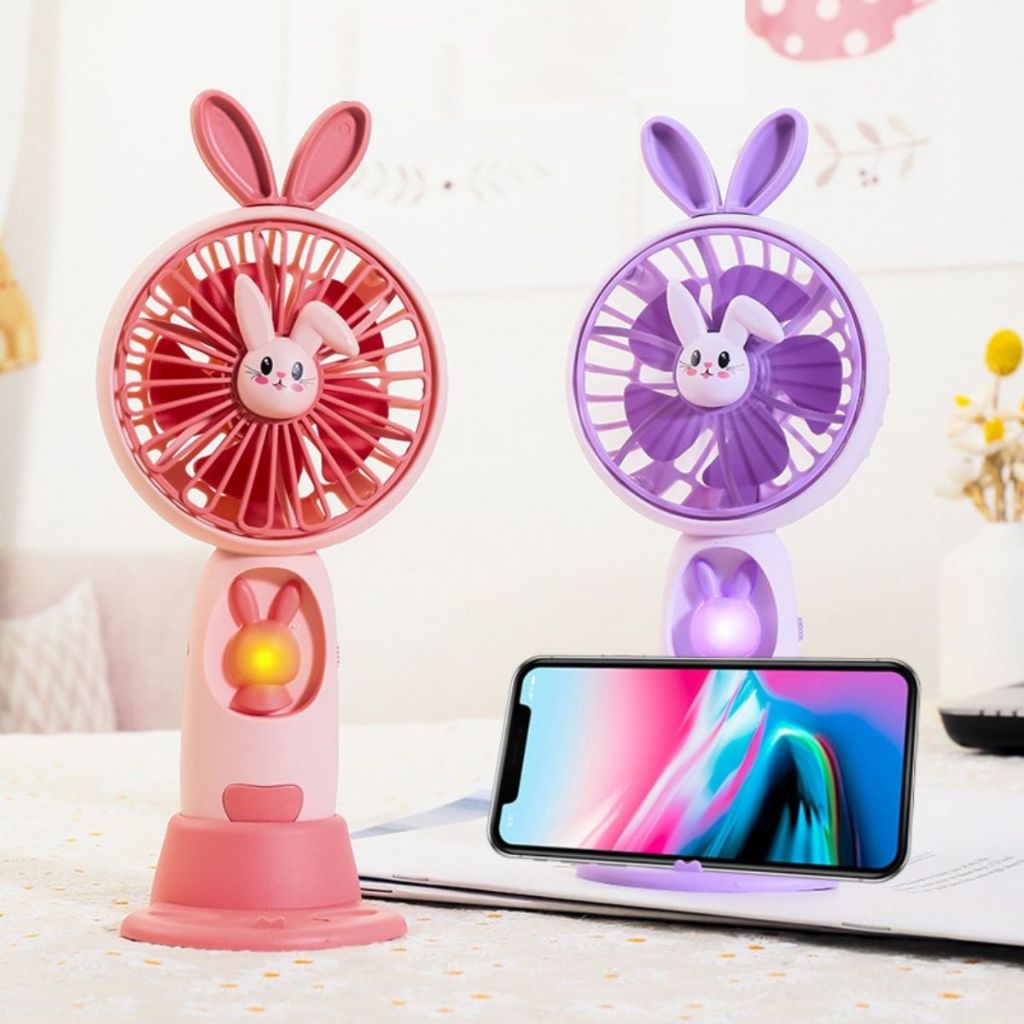 Kipas Angin Genggam Tangan Karakter Bunny Dengan LED + Holder Penyangga HP / Handy Mini Fan Portable Rechargeable Elektrik Motif Kelinci Lucu Travel Size Travelling Outdoor Konser Piknik Pantai Jogging CFD Luar Ruangan Make Up Skincare Multifungsi