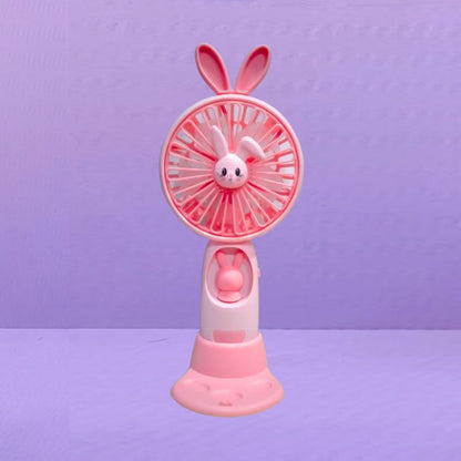 Kipas Angin Genggam Tangan Karakter Bunny Dengan LED + Holder Penyangga HP / Handy Mini Fan Portable Rechargeable Elektrik Motif Kelinci Lucu Travel Size Travelling Outdoor Konser Piknik Pantai Jogging CFD Luar Ruangan Make Up Skincare Multifungsi