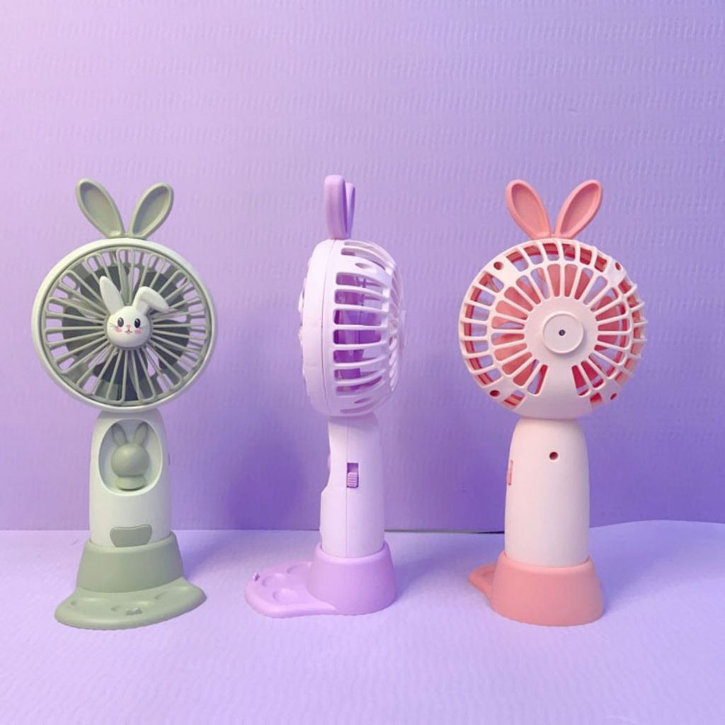 Kipas Angin Genggam Tangan Karakter Bunny Dengan LED + Holder Penyangga HP / Handy Mini Fan Portable Rechargeable Elektrik Motif Kelinci Lucu Travel Size Travelling Outdoor Konser Piknik Pantai Jogging CFD Luar Ruangan Make Up Skincare Multifungsi
