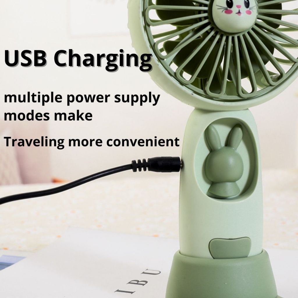 Kipas Angin Genggam Tangan Karakter Bunny Dengan LED + Holder Penyangga HP / Handy Mini Fan Portable Rechargeable Elektrik Motif Kelinci Lucu Travel Size Travelling Outdoor Konser Piknik Pantai Jogging CFD Luar Ruangan Make Up Skincare Multifungsi